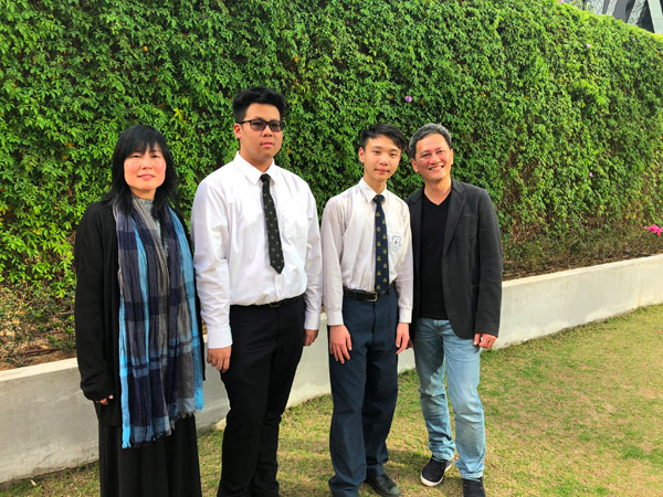 Ms Vivienne Chiu, Head of Corporate Communications of OCL (first left), Mr Sammy Kam, Technical Director of OCL (first right), Wong Chung Yin Jerry, champion in the Secondary Senior category last year (second left) and Lee Hok-yin, champion in the Secondary Junior category last year (second right).